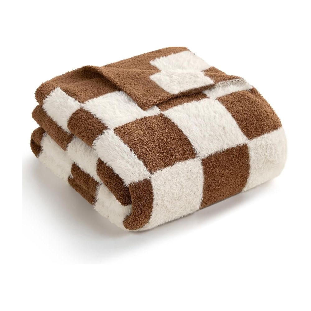 This throw blanket is crafted from a unique blend of faux fur and feather yarn, offering the luxurious feel of faux fur combined with the soft, cozy and fluffy texture of feather yarn. Elevate your home decor with this elegant and comfortable addition.